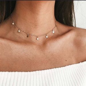Gold tone star choker necklace